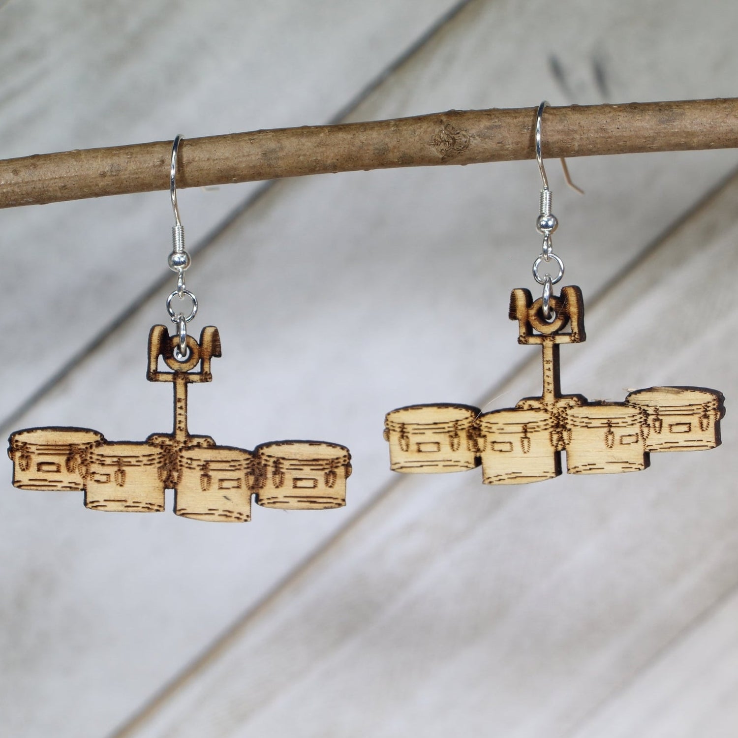 Hand-painted wooden quad drum dangle earrings featuring a marching tenor drum set design with multiple drums and hardware detail and hypoallergenic sterling silver hooks, lightweight jewelry for marching band members and percussionists