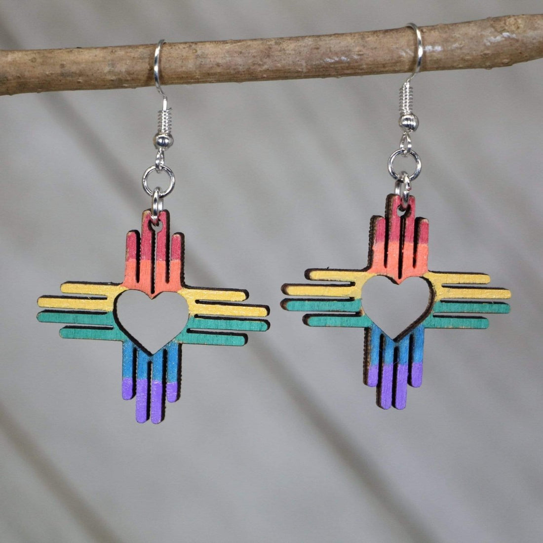 Hand-painted wooden rainbow Zia heart dangle earrings with New Mexico sun symbol design and hypoallergenic sterling silver hooks, lightweight pride statement jewelry earrings for NM style and LGBTQ expression