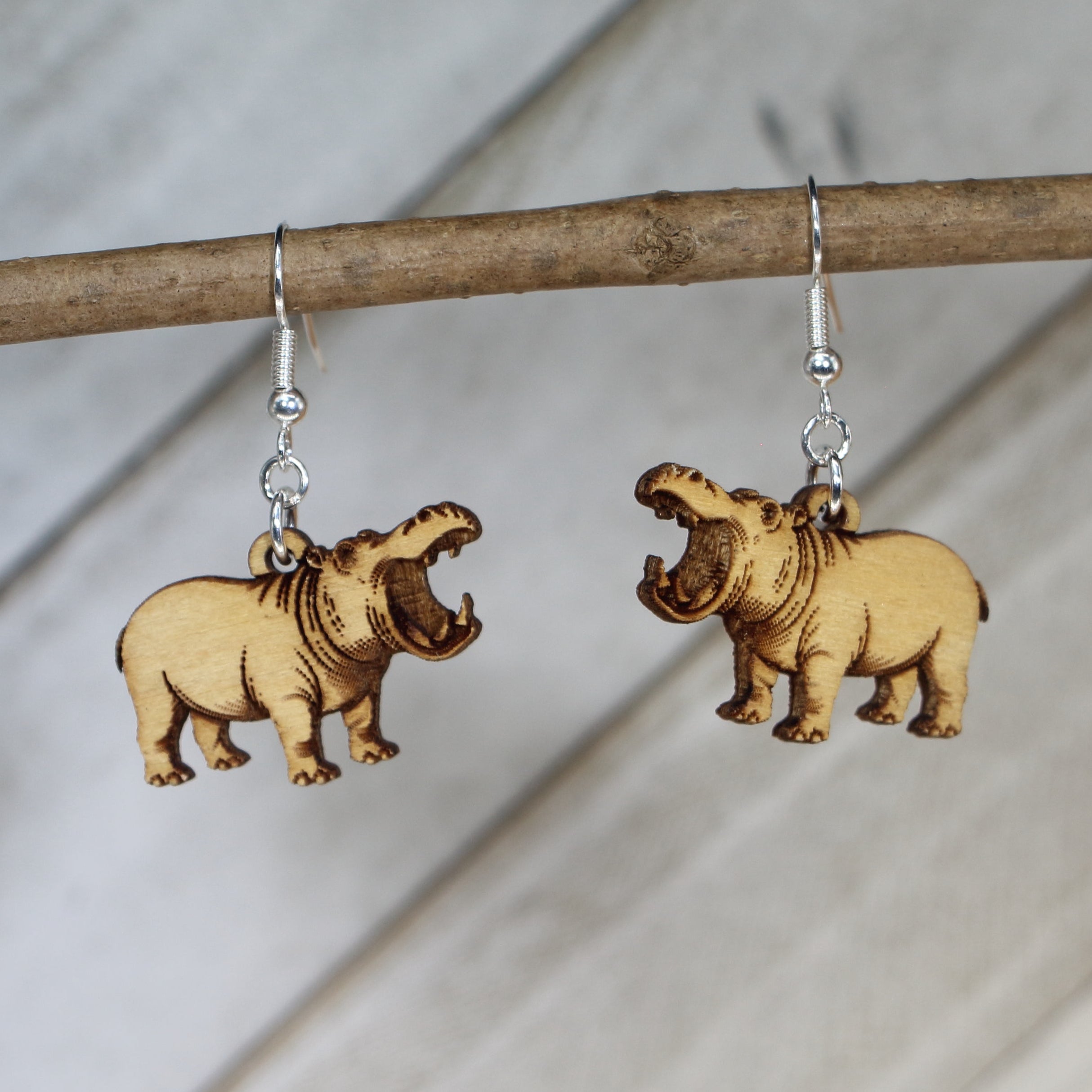 Hand-painted wooden realistic hippo dangle earrings with detailed wildlife animal design and hypoallergenic sterling silver hooks, lightweight safari jewelry for animal lovers and nature enthusiasts by Cate’s Concepts
