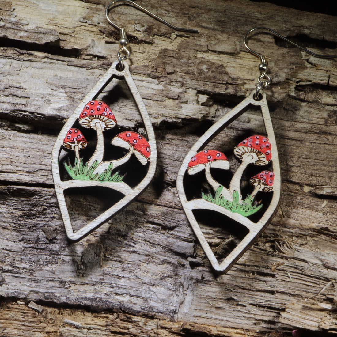 Hand-painted red mushroom garden wooden dangle earrings on hypoallergenic .925 sterling silver hooks. Lightweight cottagecore nature jewelry for mushroom lovers, gardeners, forest explorers, and whimsical woodland enthusiasts.