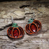 Resin pumpkin wooden dangle earrings featuring a hand-painted autumn pumpkin design with glossy resin accents. Lightweight fall earrings with hypoallergenic .925 sterling silver hooks, perfect for pumpkin lovers, Thanksgiving, harvest festivals, autumn outfits, farmers markets, and seasonal fall jewelry.