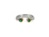 A split shank ring made of sterling silver with two 10k rose gold bezel set emeralds, made by hand with recycled metals and ethically sourced stones