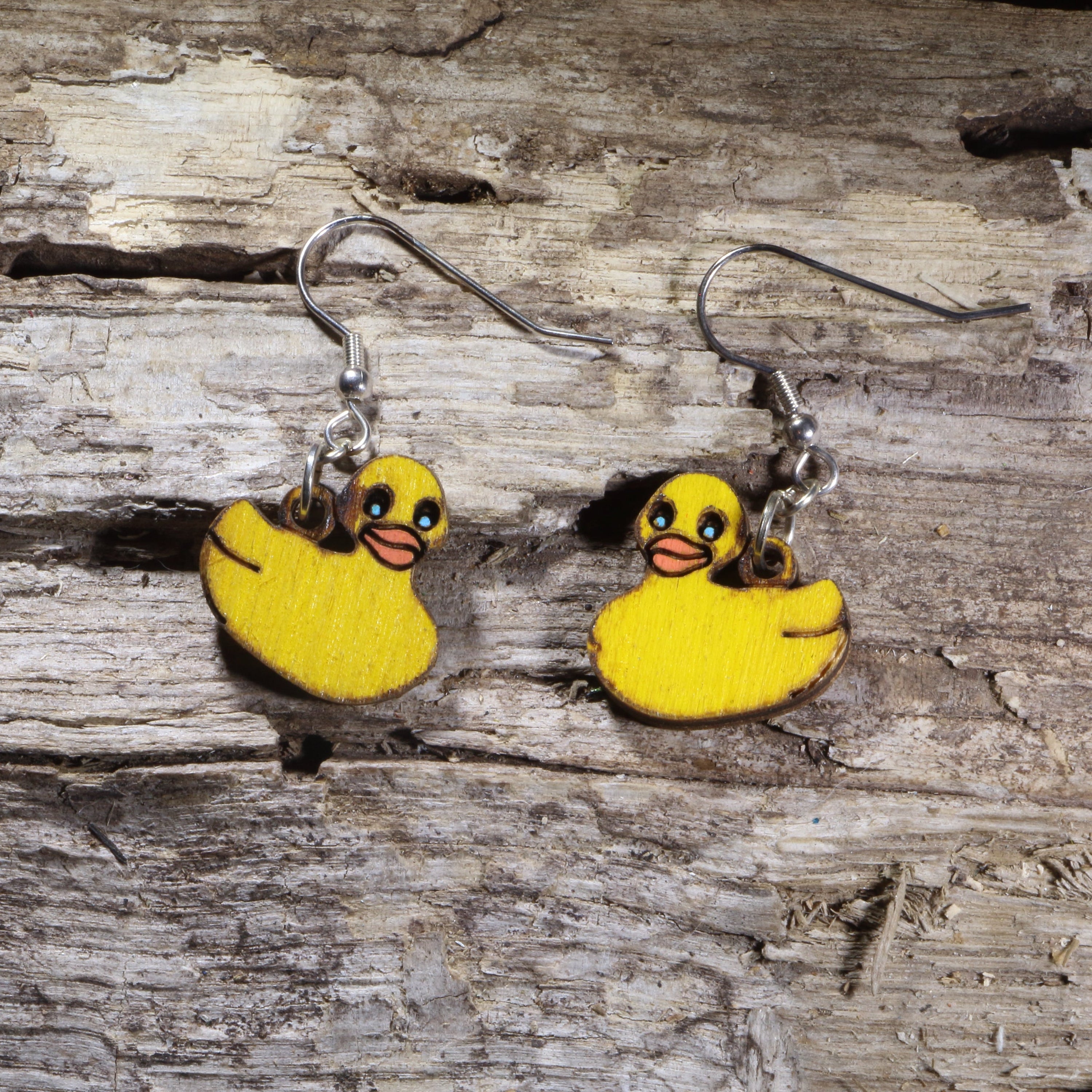 Handcrafted Rubber Duck wooden dangle earrings featuring adorable yellow rubber duck designs. Lightweight laser-cut wooden earrings with hypoallergenic .925 sterling silver hooks, perfect for duck lovers, bath toy fans, animal jewelry collectors, whimsical fashion, and anyone who loves cute novelty accessories.