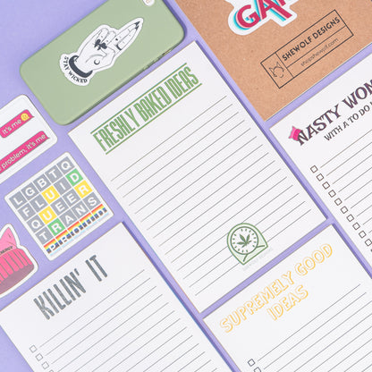 Collection of colorful notepads with various designs and text.