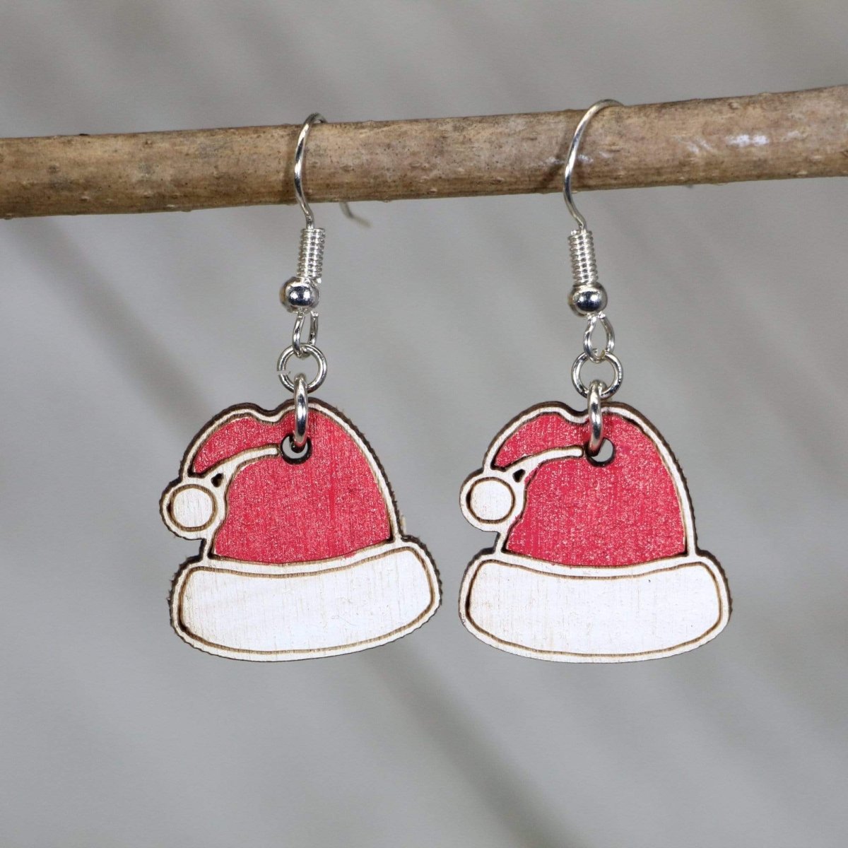 Hand-painted wooden Santa hat dangle earrings with festive Christmas holiday design and hypoallergenic sterling silver hooks, lightweight Santa hat statement jewelry earrings for holiday parties and seasonal style