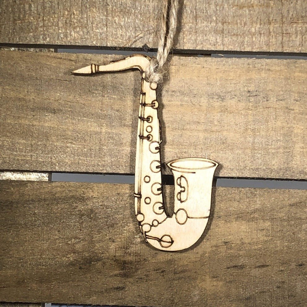 Hand-painted wooden saxophone Christmas ornament featuring a detailed curved instrument design with keys and bell, festive holiday decor for band members and music lovers by Cate’s Concepts