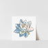 A printed art of a lotus flower with blue, pink, and white colors on a white background, with a visible signature at the bottom right corner.