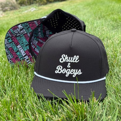 A black snapback cap with white embroidered text reading &