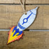 Hand-painted wooden silver rocket Christmas ornament featuring a sleek space-themed design with metallic finish and pointed nose cone, festive holiday decor for space enthusiasts and sci-fi lovers by Cate’s Concepts