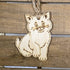 Hand-painted wooden sitting cat Christmas ornament with cute feline design and lightweight festive decor, adorable cat lover holiday tree decoration gift