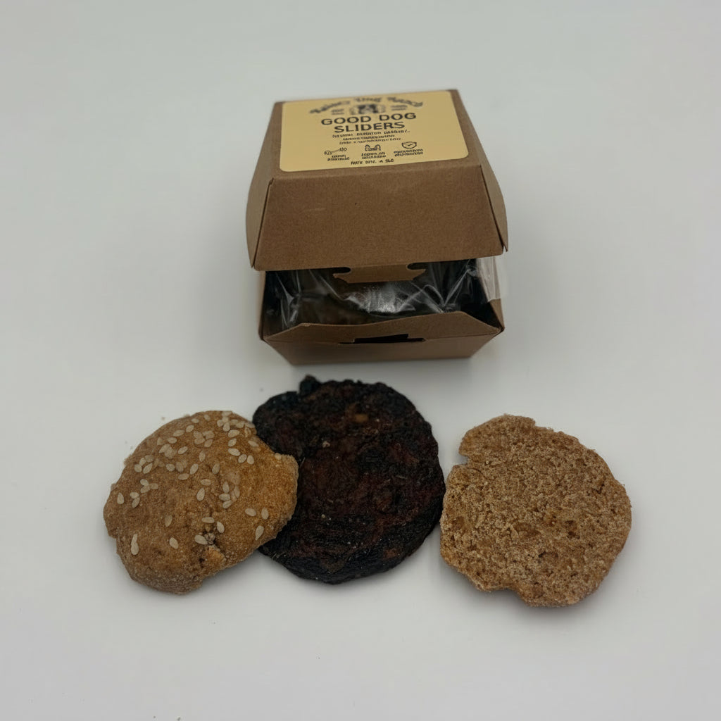 Three textured bath stones in brown, black, and tan are displayed in front of their open kraft paper packaging box on a light gray background.