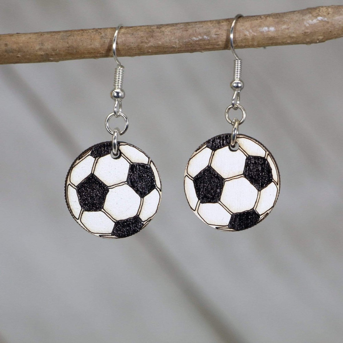 Hand-painted wooden soccer ball dangle earrings with classic black and white design and hypoallergenic sterling silver hooks, lightweight soccer statement jewelry earrings for players, fans, and soccer moms