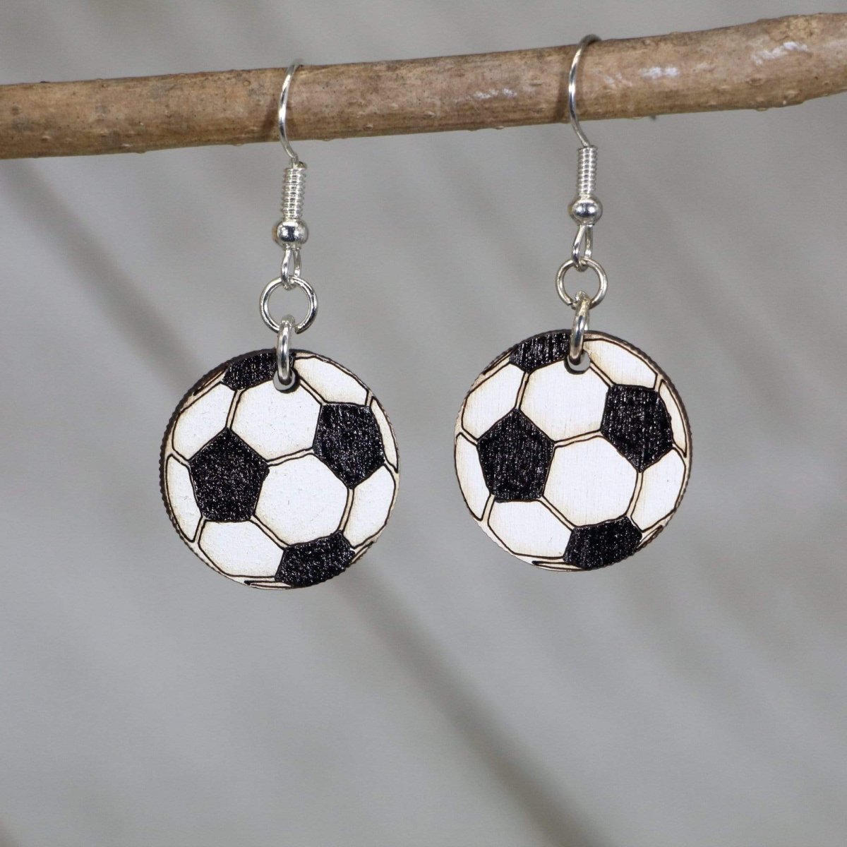 Hand-painted wooden soccer ball dangle earrings with classic black and white design and hypoallergenic sterling silver hooks, lightweight soccer statement jewelry earrings for players, fans, and soccer moms