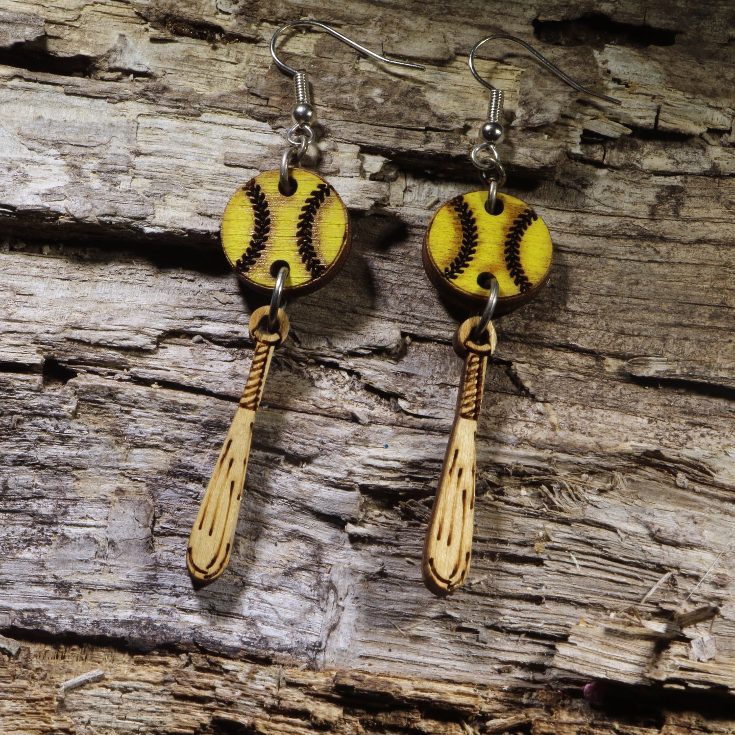 Hand-painted wooden softball and bat dangle earrings on hypoallergenic .925 sterling silver hooks. Lightweight softball jewelry for players, coaches, team moms, tournament weekends, game days, and sports fans.