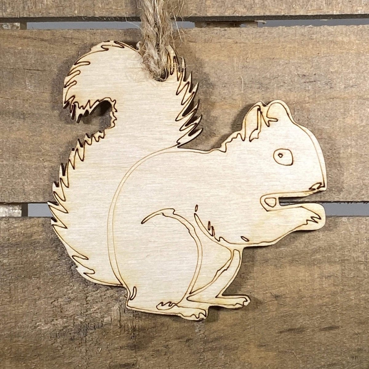 Hand-painted wooden squirrel Christmas ornament featuring a charming woodland animal design with bushy tail and natural detailing, festive holiday decor for nature lovers and rustic cabin style homes by Cate’s Concepts
