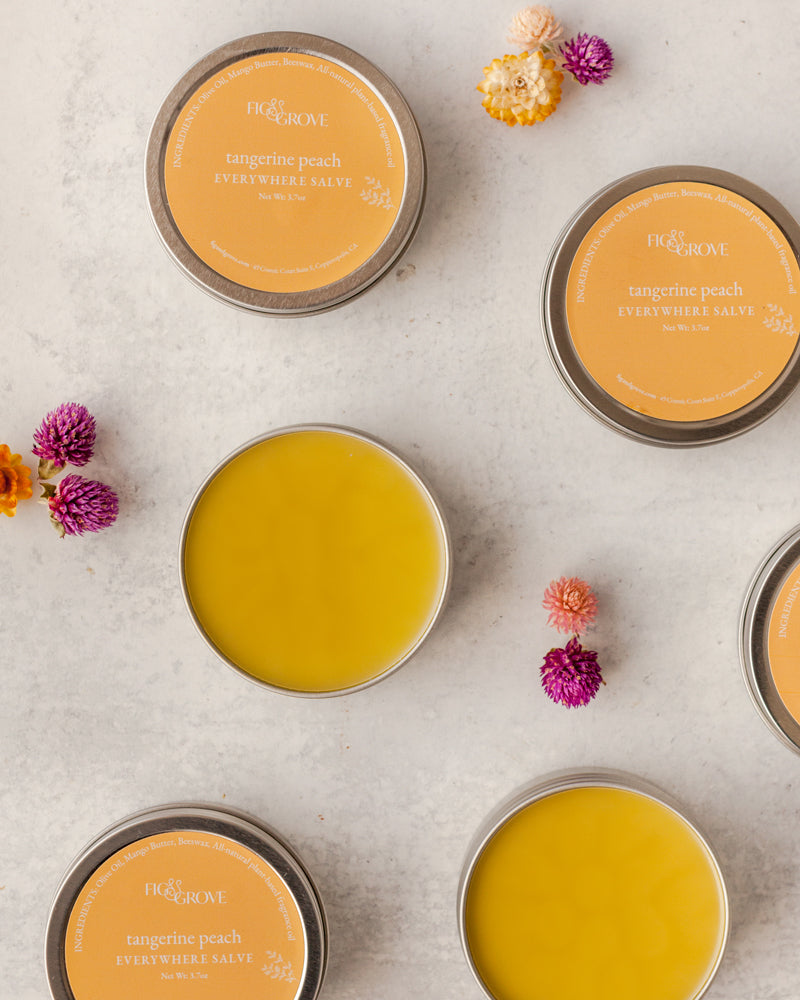 Fig &amp; Grove Tangerine Peach Everywhere Salve in a metal tin, natural moisturizing skin balm.