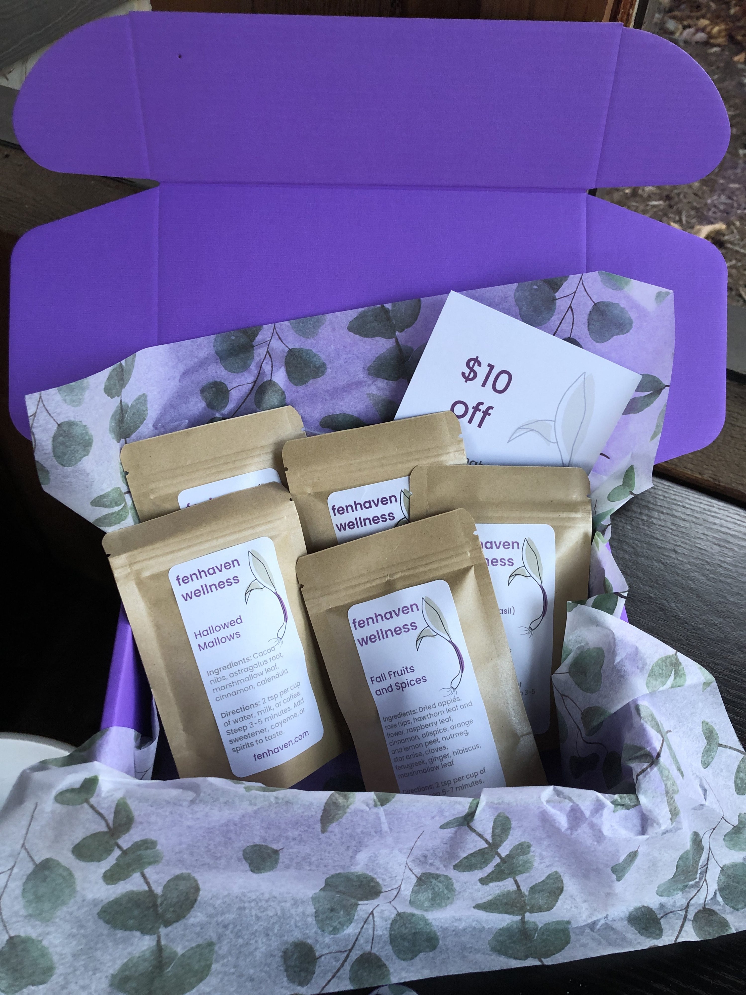 Five teas and a $10 off coupon in a bright purple gift box