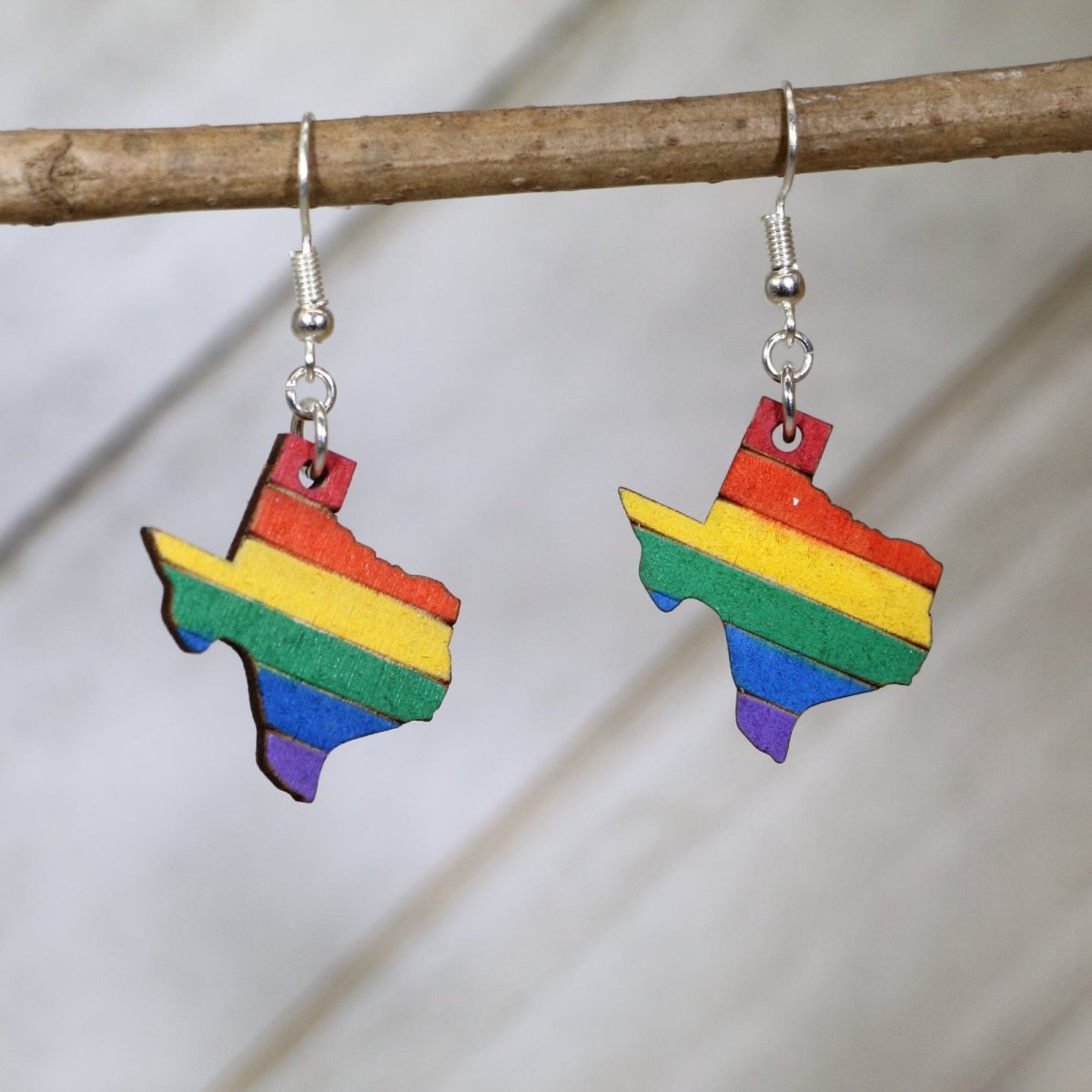 Hand-painted wooden Texas LGBTQ pride dangle earrings with rainbow state design and hypoallergenic sterling silver hooks, lightweight pride statement jewelry earrings for Texas pride and inclusive style