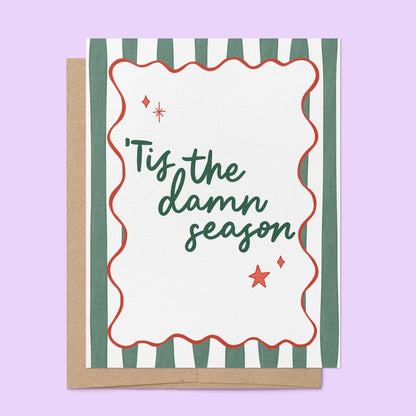 Tis the Damn Season Stripes Holiday Card flat lay — retro green stripe illustrated holiday card by indie artist MangoIllustrated