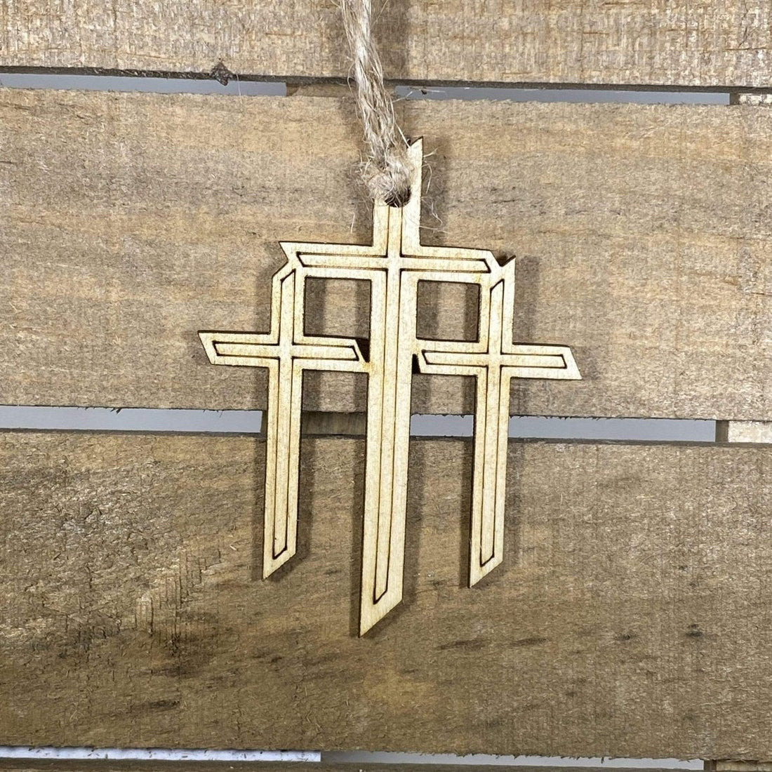 Hand-painted wooden triple cross Christmas ornament featuring three crosses with symbolic Christian design and rustic detailing, meaningful holiday decor for faith-based homes and religious celebrations by Cate’s Concepts