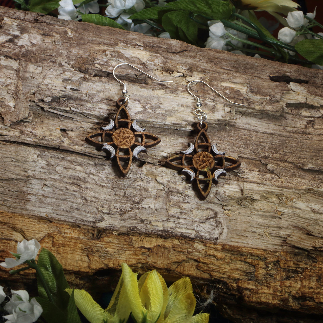 Hand-painted wooden triple moon pentacle dangle earrings featuring a Celtic-inspired pentacle and moon phase design, hypoallergenic sterling silver hooks, and lightweight Wiccan jewelry for pagans, witches, and spiritual practitioners by Cate’s Concepts.