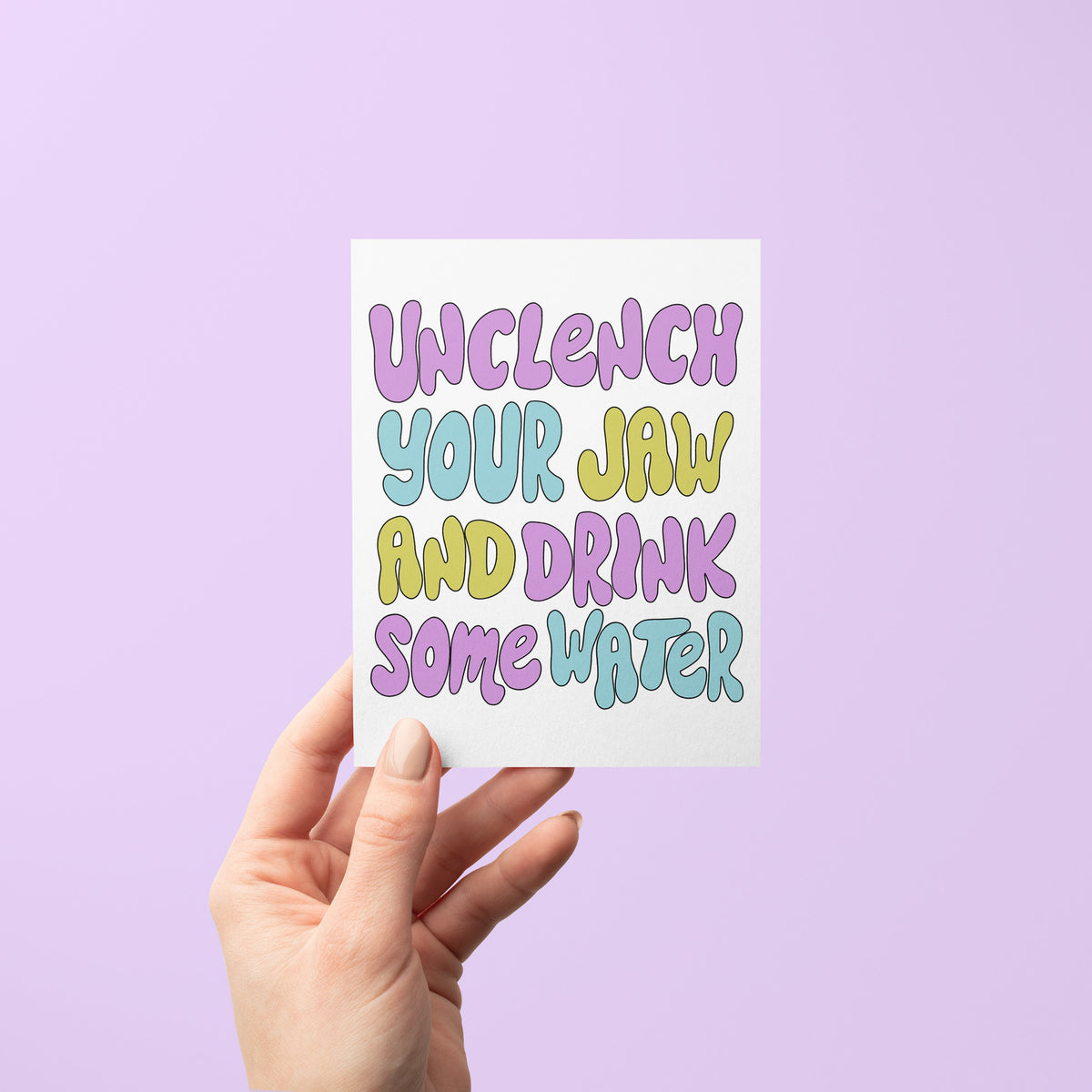 Unclench Your Jaw and Drink Some Water Funny Friendship Card flat lay — funny self care and mental health card by indie artist MangoIllustrated