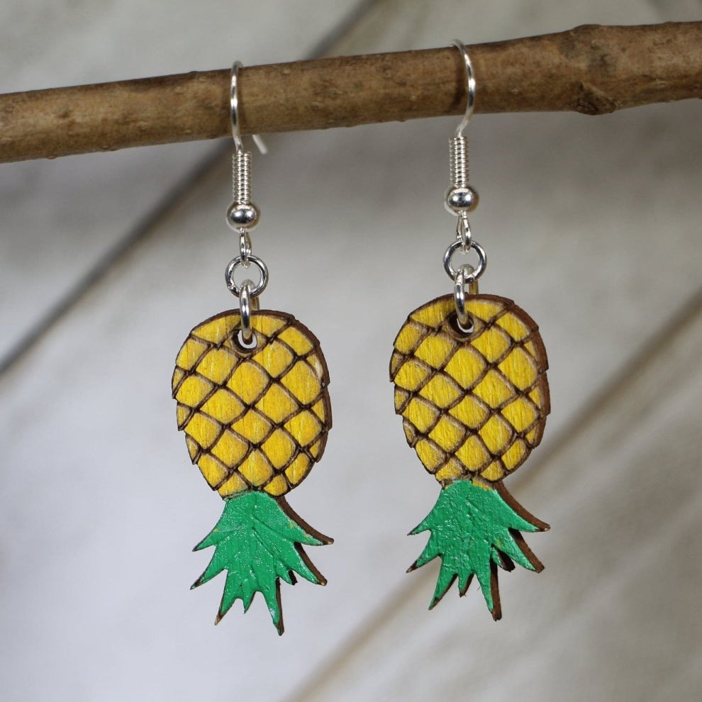 Hand-painted wooden upside down pineapple dangle earrings with playful tropical design and hypoallergenic sterling silver hooks, cheeky novelty statement jewelry for fun conversation starters