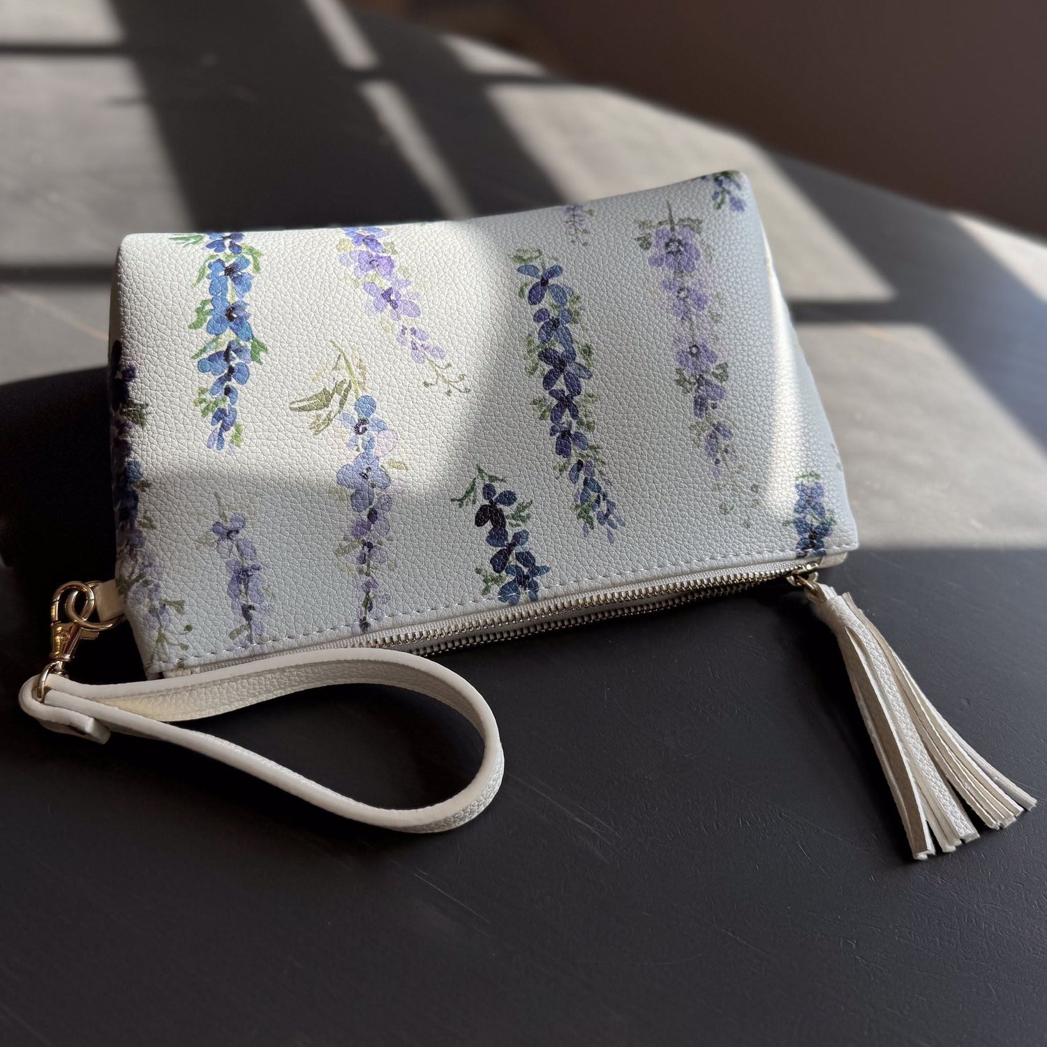 dancing delphinium clutch in vegan leather