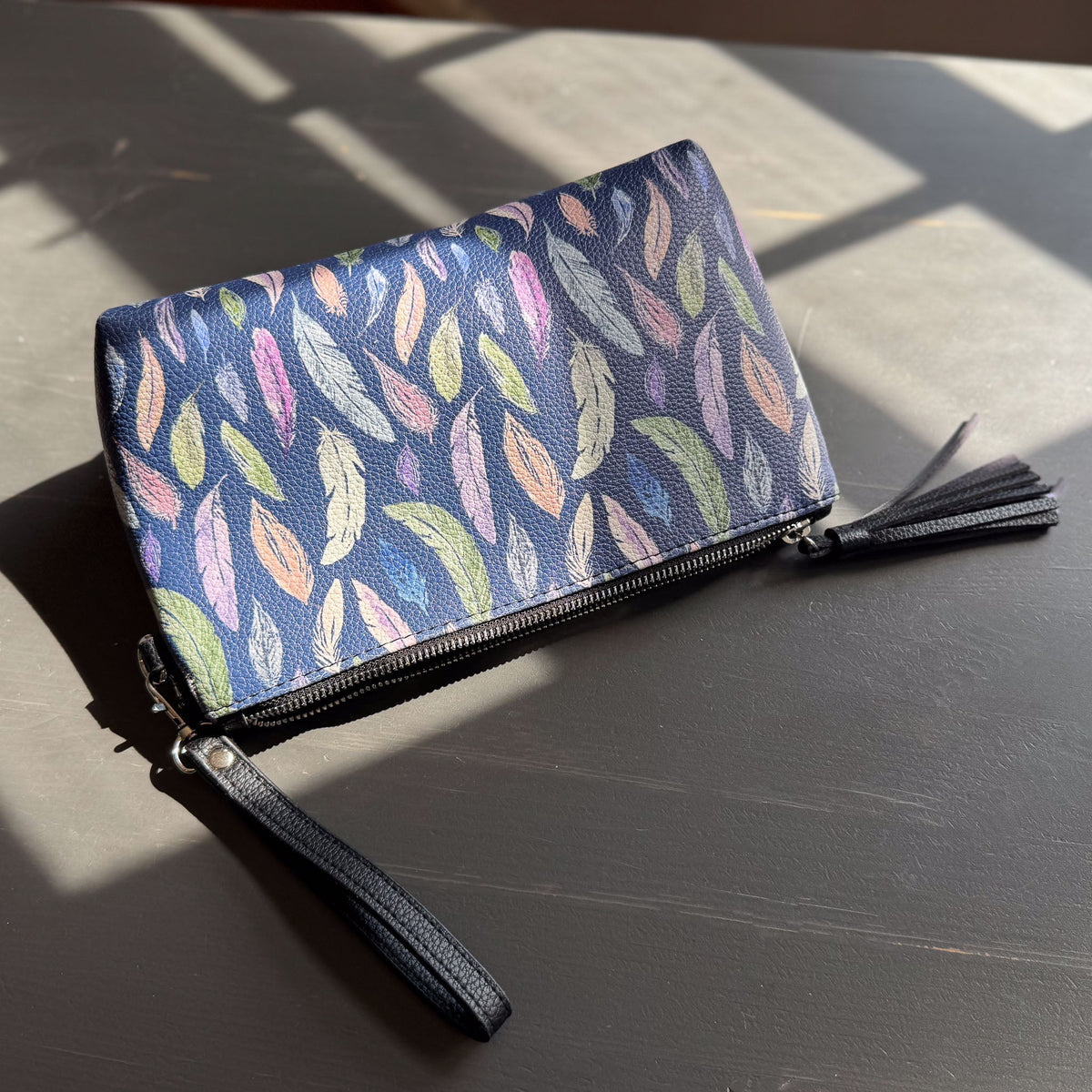 the featherlight clutch collection in vegan leather