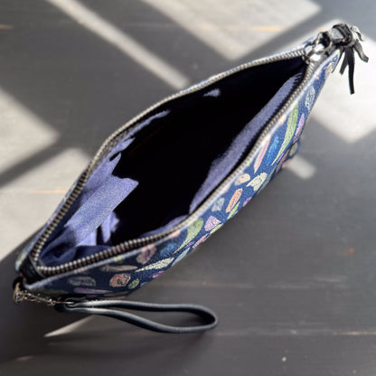 the featherlight clutch collection in vegan leather