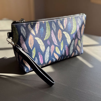 the featherlight clutch collection in vegan leather