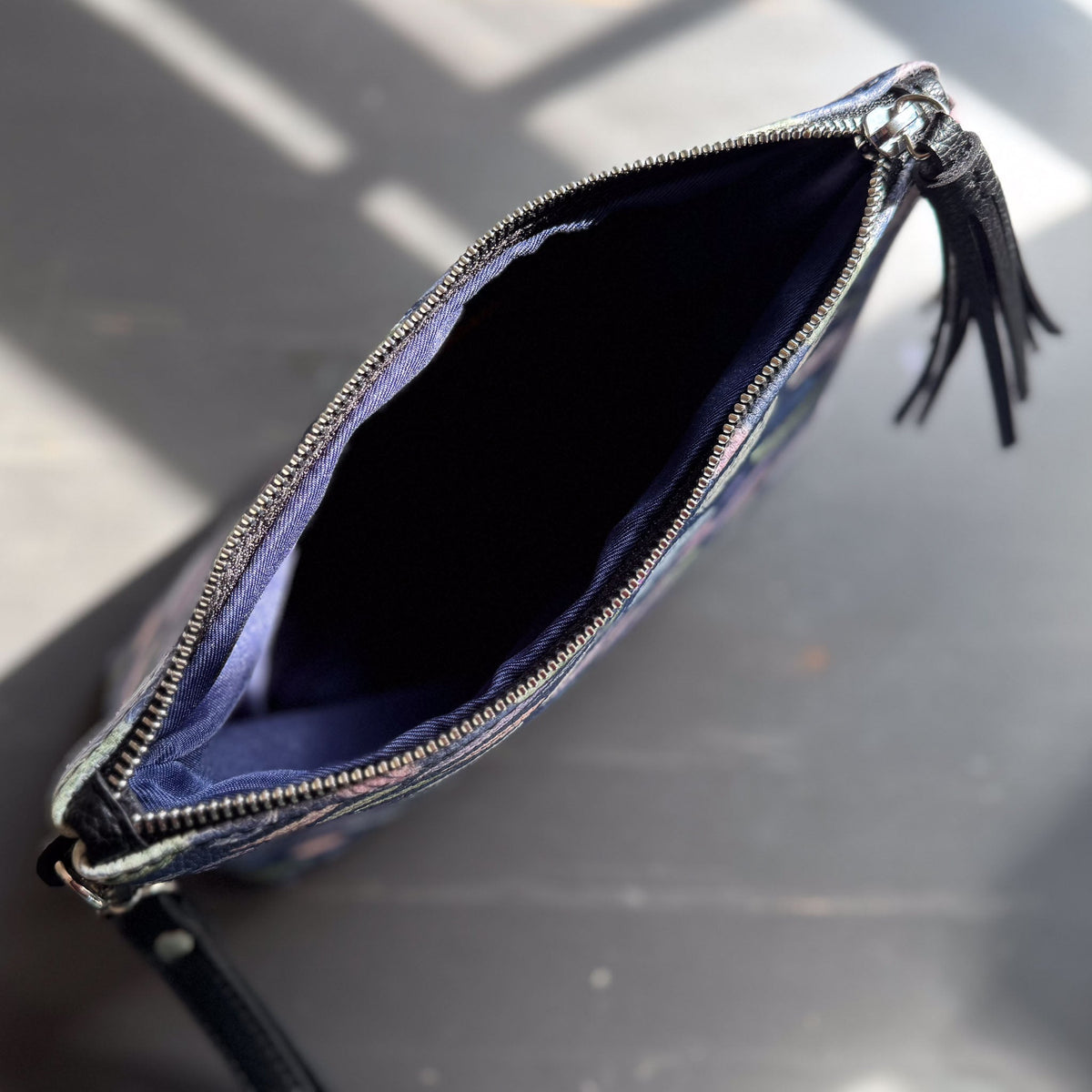 the featherlight clutch collection in vegan leather