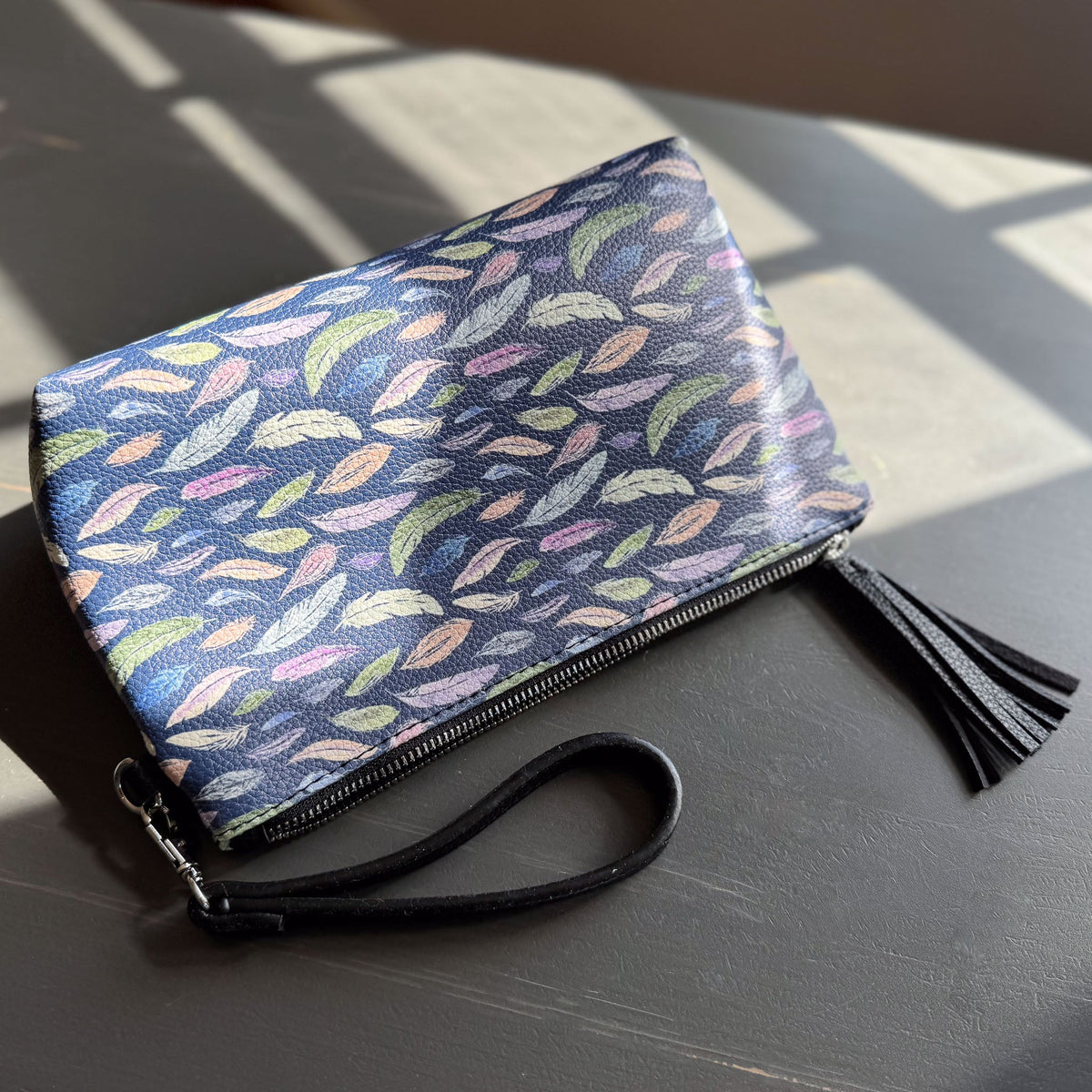 the featherlight clutch collection in vegan leather