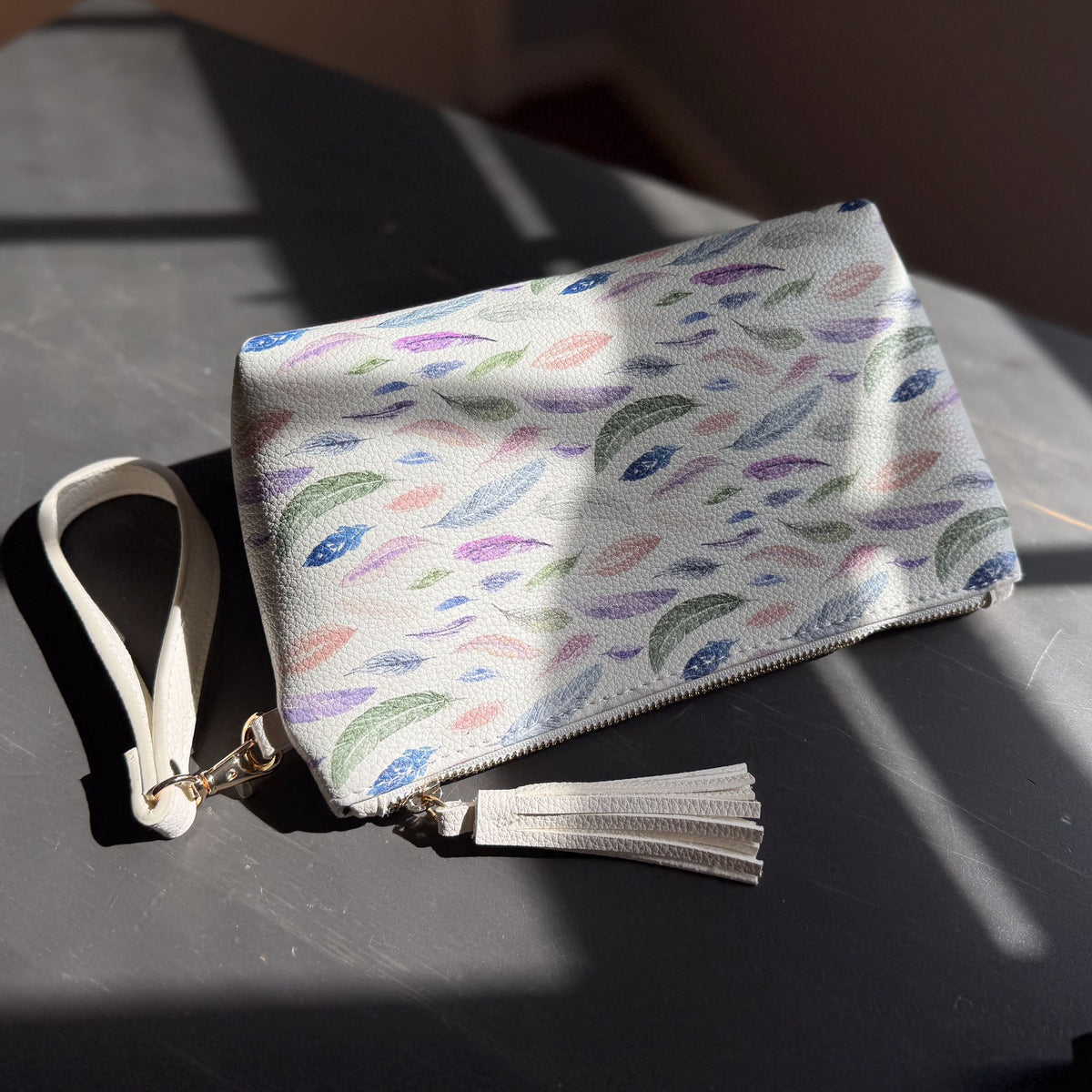 the featherlight clutch collection in vegan leather