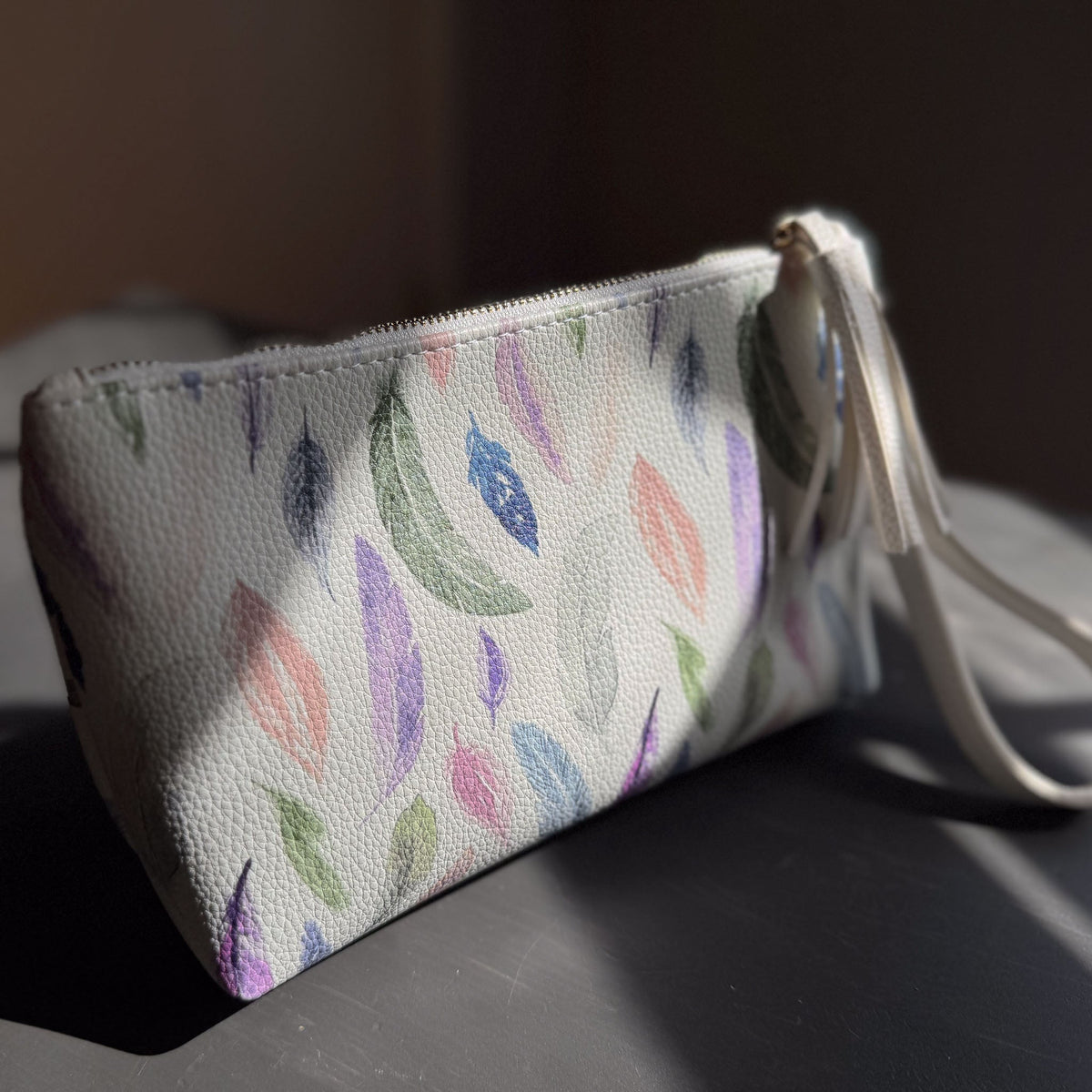 the featherlight clutch collection in vegan leather