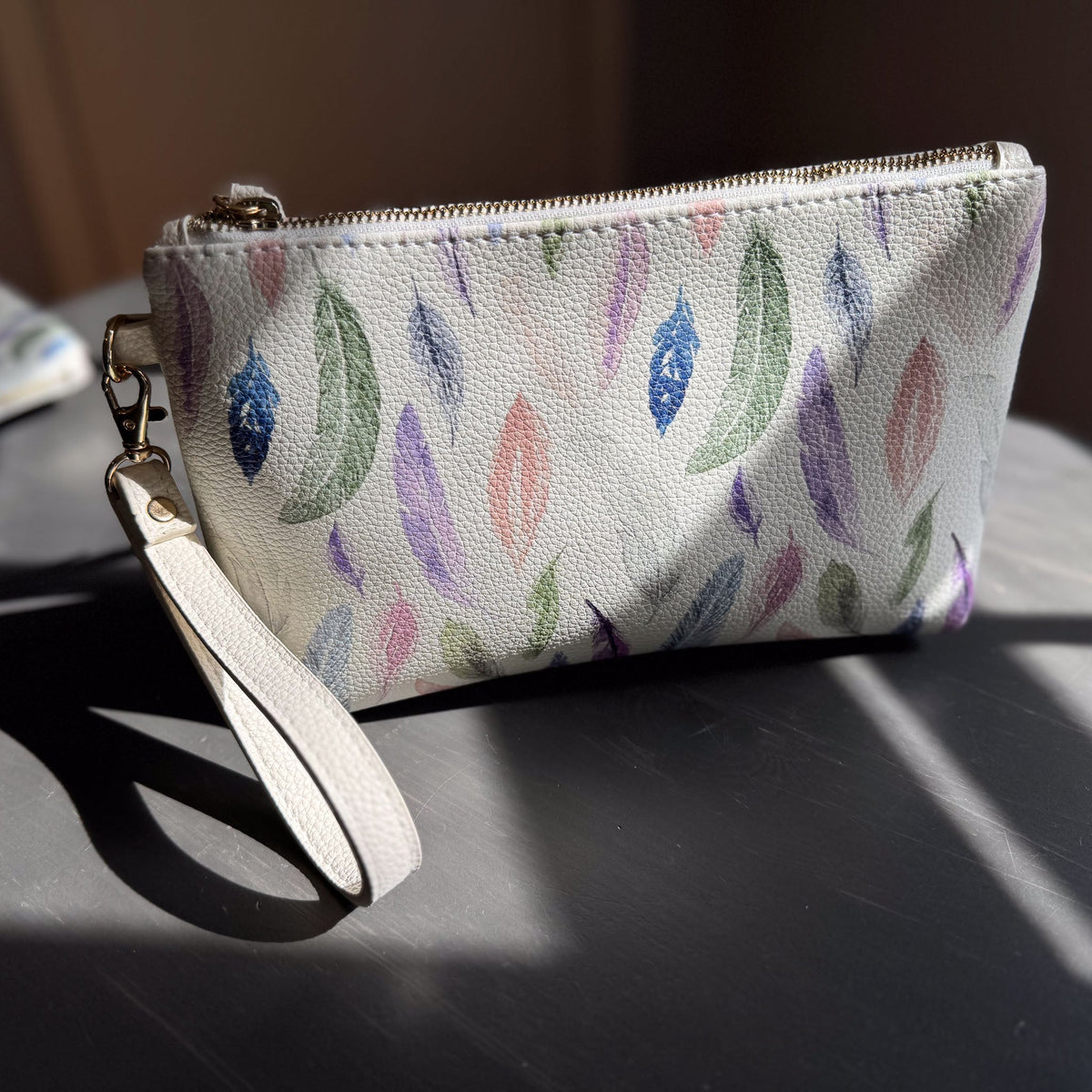 the featherlight clutch collection in vegan leather