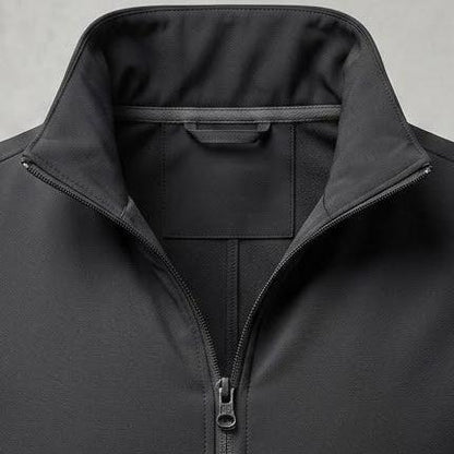 A black zip-up vest with a stand-up collar, shown on a neutral gray textured background.