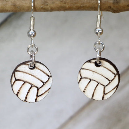 Hand-painted wooden volleyball dangle earrings featuring a detailed ball design with classic panel lines and sporty styling and hypoallergenic sterling silver hooks, lightweight jewelry for volleyball players and sports enthusiasts by Cate’s Concepts