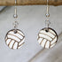 Hand-painted wooden volleyball dangle earrings featuring a detailed ball design with classic panel lines and sporty styling and hypoallergenic sterling silver hooks, lightweight jewelry for volleyball players and sports enthusiasts by Cate’s Concepts