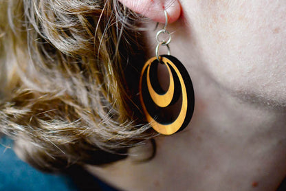 Wooden hoop earrings shown from alternate angle, 2-inch hardwood hoops with quarter-inch profile on nickel-free sterling silver