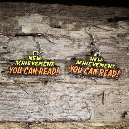 Handcrafted "You Can Read!" wooden dangle earrings featuring an encouraging reading message for educators and literacy advocates. Lightweight laser-cut wooden earrings with hypoallergenic .925 sterling silver hooks, perfect for teachers, reading specialists, librarians, literacy coaches, elementary educators, and book lovers.