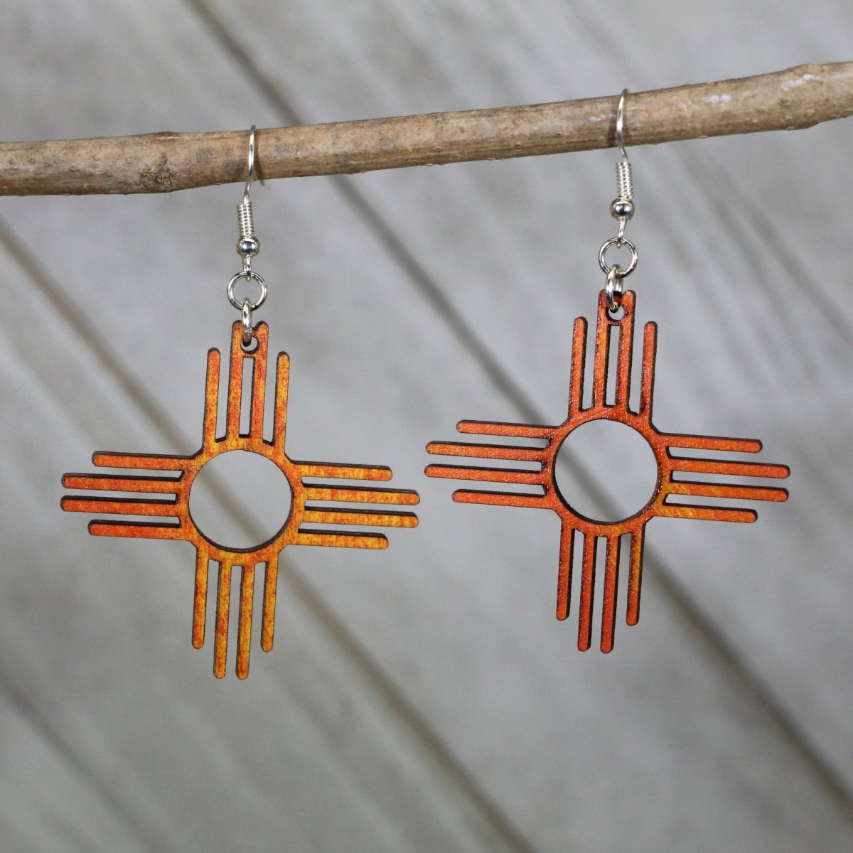 Hand-painted wooden Zia sun symbol dangle earrings with New Mexico state design and hypoallergenic sterling silver hooks, lightweight Zia statement jewelry earrings for southwestern style and NM pride