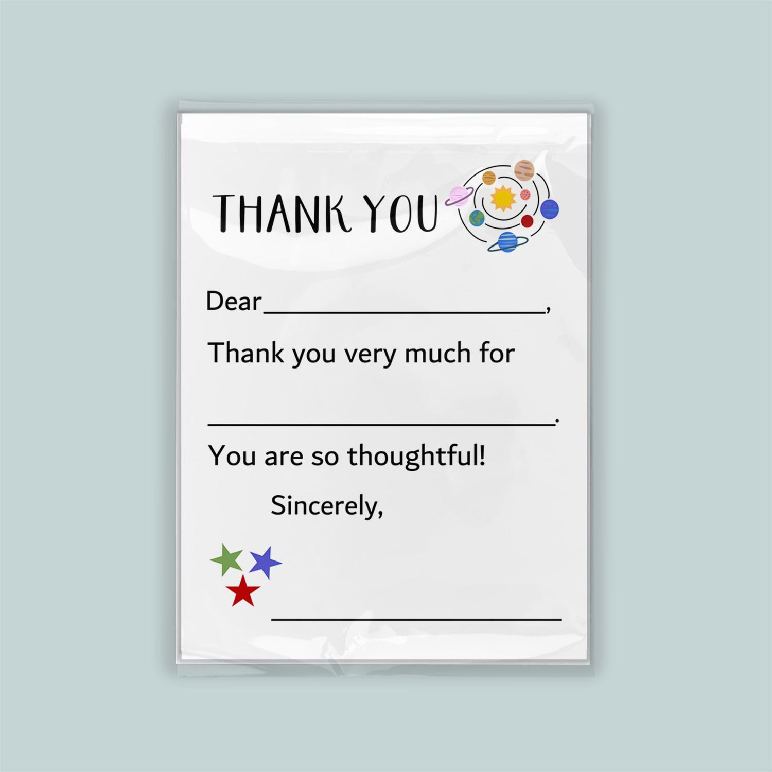 The image is a white thank you card with a space-themed design, including planets and stars. The card has a blank space for a recipient&