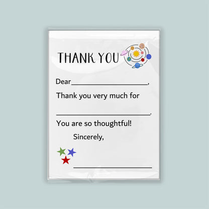 The image is a white thank you card with a space-themed design, including planets and stars. The card has a blank space for a recipient&