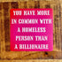 A square pink sign with bold white text reading &