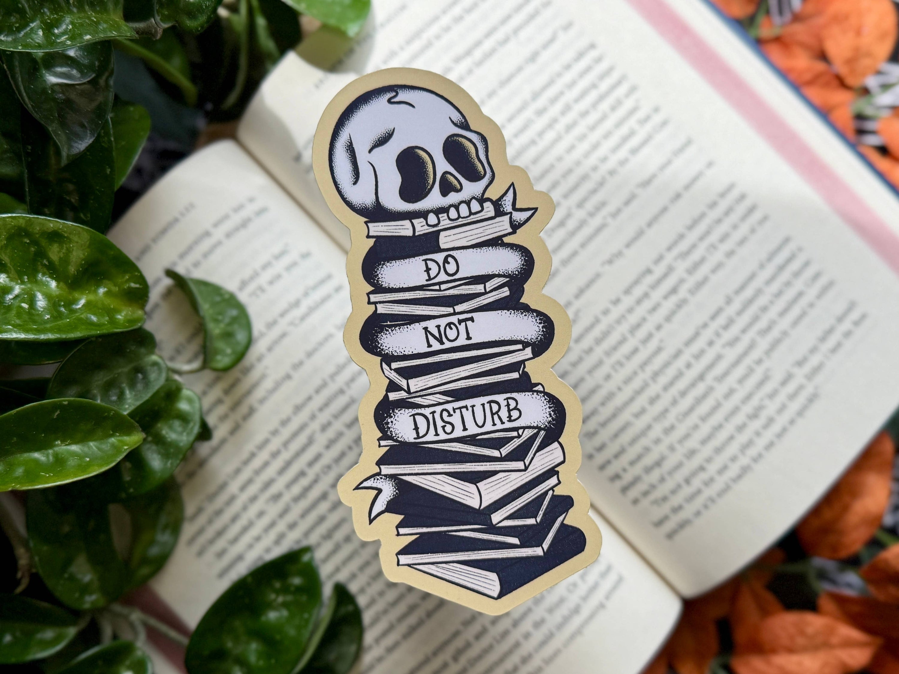 Skull-shaped sticker with &