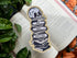 Skull-shaped sticker with &