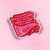 A red die-cut sticker with a white border featuring the text &