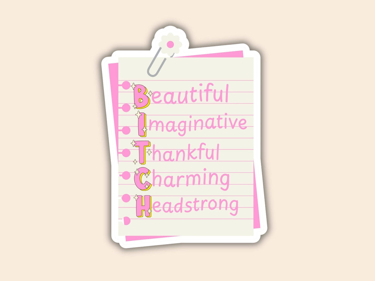 A die-cut sticker designed to look like a lined notepad page clipped at the top, featuring the word &
