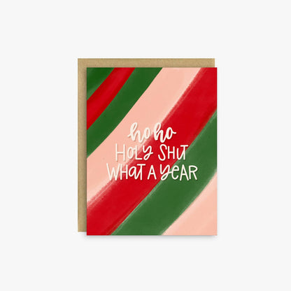 A square greeting card with a kraft envelope, featuring diagonal stripes in red, green, and pale pink with white text reading &